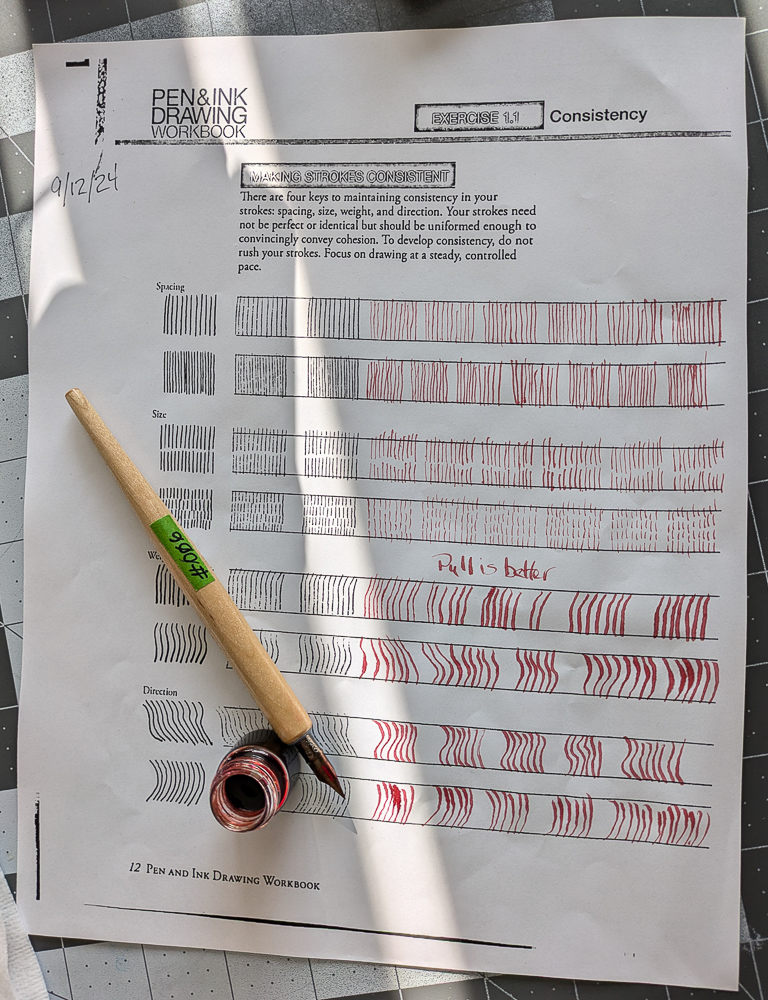 The completed lesson with small ink holder and pen